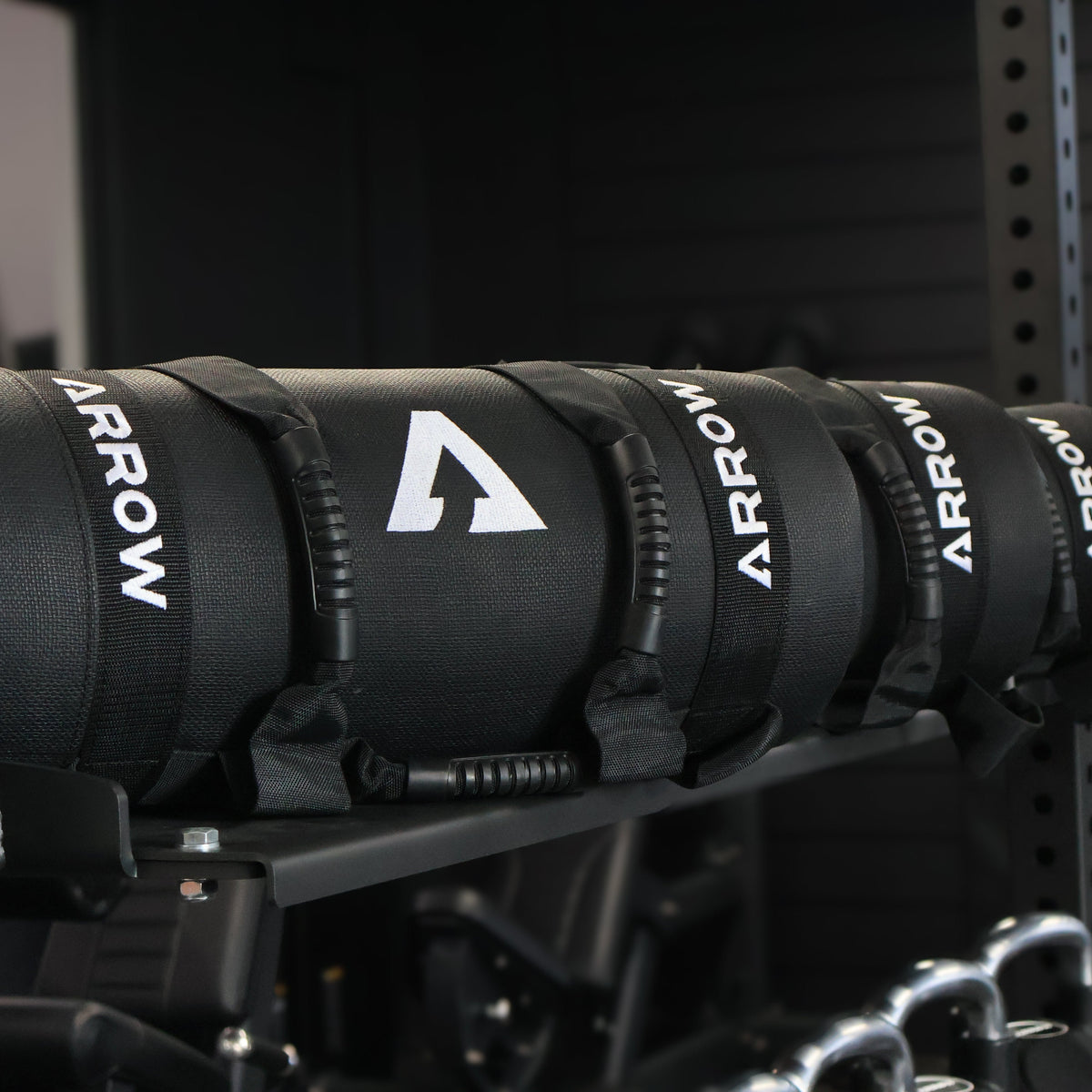 Black Arrow WEIGHTED BAGS on a metal rack Hyrox Training