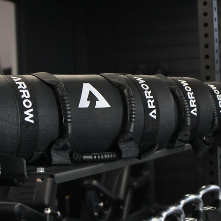 Black Arrow WEIGHTED BAGS on a metal rack Hyrox Training