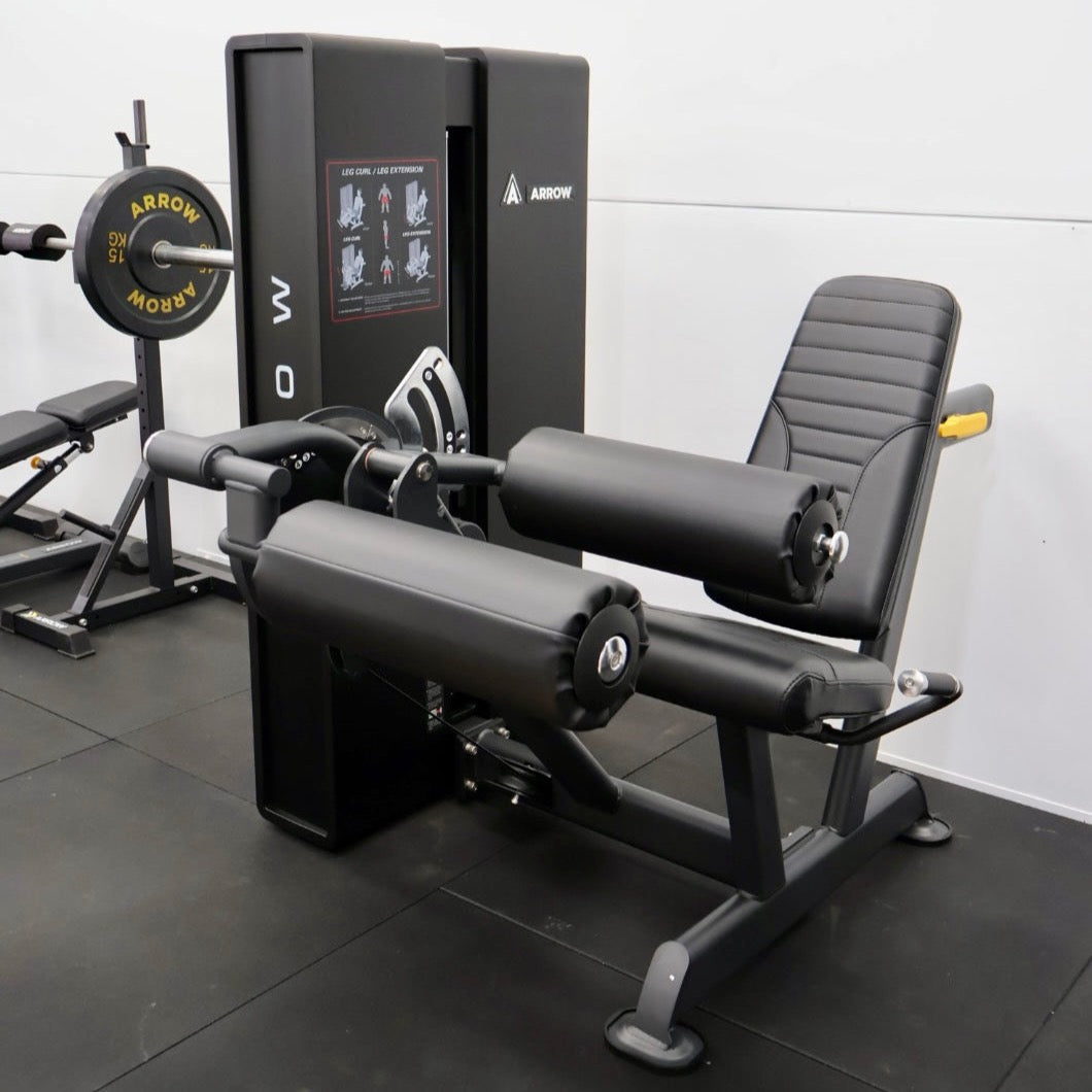 Leg extension and leg curl exercise machines