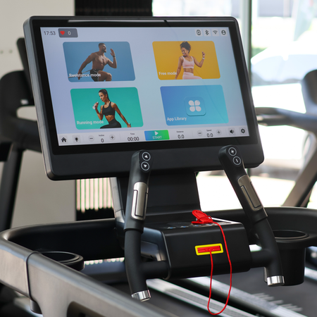 Digital display on a treadmill with workout app interface