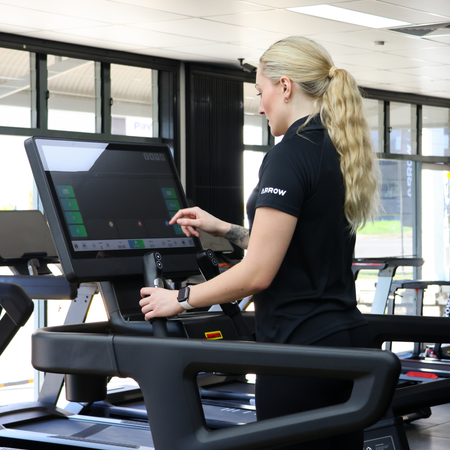 Treadmill with a digital display in a gym setting
